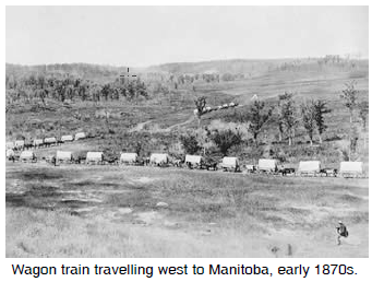 Wagon train travelling west to Manitoba, early 1870s.