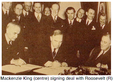 Mackenzie King (centre) signing deal with Roosevelt (R)